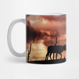 silhouette of a bull in a sunset Mug